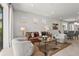 Bright living room features modern furniture, stylish decor, and natural light at 6295 Crested Eagle Ln, Nokomis, FL 34275