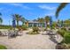 Elegant outdoor patio with ample seating and lush landscaping, perfect for relaxing and entertaining at 6295 Crested Eagle Ln, Nokomis, FL 34275