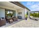 Outdoor patio with wicker furniture, fan, and sun loungers, perfect for enjoying the weather at 6295 Crested Eagle Ln, Nokomis, FL 34275