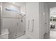 Modern shower with glass enclosure, built-in bench, mosaic tile accents, and chrome shower fixtures at 6295 Crested Eagle Ln, Nokomis, FL 34275