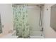 Bright bathroom with a shower and tub combination and decorative shower curtain at 6462 Wild Oak Bay Blvd # 245, Bradenton, FL 34210