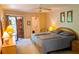 This bright bedroom offers a ceiling fan, closet, and access to the outdoors at 6462 Wild Oak Bay Blvd # 245, Bradenton, FL 34210