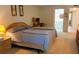 Comfortable bedroom features a large bed, desk area, and ensuite bathroom access at 6462 Wild Oak Bay Blvd # 245, Bradenton, FL 34210
