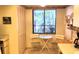 Cozy breakfast nook with natural light and seating for two at 6462 Wild Oak Bay Blvd # 245, Bradenton, FL 34210