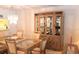 Elegant dining room with glass table, chairs, and display cabinet at 6462 Wild Oak Bay Blvd # 245, Bradenton, FL 34210