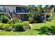 Two-story condo building with well-manicured lawn and mature landscaping at 6462 Wild Oak Bay Blvd # 245, Bradenton, FL 34210