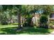 Beautifully landscaped condo complex with mature trees, lush green grass and manicured shrubbery at 6462 Wild Oak Bay Blvd # 245, Bradenton, FL 34210