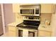 Kitchen with modern appliances, including a stainless steel oven and microwave at 6462 Wild Oak Bay Blvd # 245, Bradenton, FL 34210
