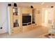Spacious entertainment center with storage and display shelves in a neutrally decorated living room at 6462 Wild Oak Bay Blvd # 245, Bradenton, FL 34210
