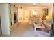 Bright and airy living room with a TV cabinet, leading into dining area at 6462 Wild Oak Bay Blvd # 245, Bradenton, FL 34210