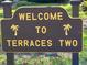 Terraces Two community sign with palm tree icons at 6462 Wild Oak Bay Blvd # 245, Bradenton, FL 34210