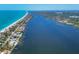 Panoramic aerial view of a coastal neighborhood, beach and canal with boat docks at 7985 Manasota Key Rd, Englewood, FL 34223