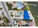 An aerial view of a large home with a private pool, landscaped yard, and waterfront access at 7985 Manasota Key Rd, Englewood, FL 34223