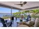 Covered balcony provides shade and a beautiful water view, plenty of furniture for guests at 7985 Manasota Key Rd, Englewood, FL 34223