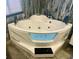 A luxurious bathroom features a sleek, modern corner jetted tub at 7985 Manasota Key Rd, Englewood, FL 34223