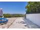 Bocce ball court adjacent to brick patio and waterfront with a colorful set of bocce balls at 7985 Manasota Key Rd, Englewood, FL 34223