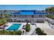 Beautiful two-story home with a pool, lounge chairs, and a picturesque waterfront setting at 7985 Manasota Key Rd, Englewood, FL 34223