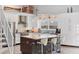 Bright kitchen with large center island with bar seating, stainless appliances and a beautiful water view at 7985 Manasota Key Rd, Englewood, FL 34223