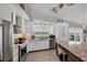 Spacious kitchen with stainless appliances, granite counters, and a slider to enjoy the outside view of the water at 7985 Manasota Key Rd, Englewood, FL 34223