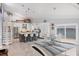 Spacious kitchen with stainless appliances and lots of natural light. Also features a dining area with water view at 7985 Manasota Key Rd, Englewood, FL 34223
