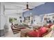 Spacious living room featuring a modern design, high ceilings, and comfortable seating areas at 7985 Manasota Key Rd, Englewood, FL 34223