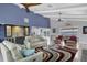 Stylish living room with a wet bar, high ceilings, water views and comfortable seating at 7985 Manasota Key Rd, Englewood, FL 34223