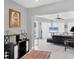 Comfortable living room with tile floors, modern decor, and view of adjacent rooms at 7985 Manasota Key Rd, Englewood, FL 34223