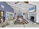 Bright living room with vaulted ceilings, a fireplace, and panoramic views of the ocean at 7985 Manasota Key Rd, Englewood, FL 34223