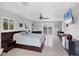 Large main bedroom featuring an ensuite bathroom and balcony access at 7985 Manasota Key Rd, Englewood, FL 34223
