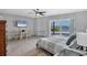 Main bedroom features tile floors, sliding glass doors, and waterfront view at 7985 Manasota Key Rd, Englewood, FL 34223