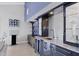 This wet bar has stainless steel backsplash, granite countertops and custom cabinets perfect for entertaining in style at 7985 Manasota Key Rd, Englewood, FL 34223