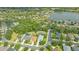 Aerial view of the property showcasing its location near a lake and other homes at 8019 Indigo Ridge Ter, Bradenton, FL 34201