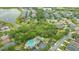 Aerial view showcasing property in a community with a pool and lake at 8019 Indigo Ridge Ter, Bradenton, FL 34201