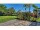 Lush backyard with mature trees and professional landscaping at 8019 Indigo Ridge Ter, Bradenton, FL 34201