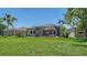 Spacious backyard featuring a screened lanai with outdoor seating at 8019 Indigo Ridge Ter, Bradenton, FL 34201