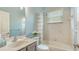 Bathroom with white vanity, tub and shower combination, and neutral finishes at 8019 Indigo Ridge Ter, Bradenton, FL 34201