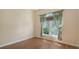 Cozy bedroom with hardwood floors and tropical-themed curtains at 8019 Indigo Ridge Ter, Bradenton, FL 34201