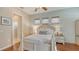 Charming bedroom boasts wood floors, a ceiling fan, and plenty of natural light at 8019 Indigo Ridge Ter, Bradenton, FL 34201