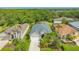 Beautiful single-story home featuring a well-manicured lawn and tropical landscaping at 8019 Indigo Ridge Ter, Bradenton, FL 34201