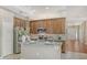 Well-lit kitchen with granite countertops, stainless steel appliances, wood cabinets, and a bright atmosphere at 8019 Indigo Ridge Ter, Bradenton, FL 34201