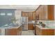 This spacious kitchen features granite countertops, stainless steel appliances, and custom wood cabinets at 8019 Indigo Ridge Ter, Bradenton, FL 34201