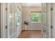 Bright office space with french doors, hardwood floors, and windows with beautiful natural light at 8019 Indigo Ridge Ter, Bradenton, FL 34201