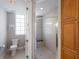 Well-lit bathroom with a glass-enclosed shower, tile flooring, and toilet at 8045 Tybee Ct # 8045, University Park, FL 34201