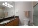 Clean bathroom featuring granite countertops, vanity with sink and a shower with a glass door at 8045 Tybee Ct # 8045, University Park, FL 34201