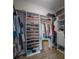 Spacious walk-in closet with organized shelving and hanging space, maximizing storage potential at 8045 Tybee Ct # 8045, University Park, FL 34201