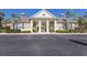 Inviting community clubhouse featuring a welcoming entrance and meticulously maintained landscaping at 8045 Tybee Ct # 8045, University Park, FL 34201