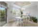 Bright dining room with natural light, stylish furnishings, and a view of the outdoor area at 8045 Tybee Ct # 8045, University Park, FL 34201