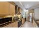 Well-equipped kitchen with modern appliances, granite countertops, and ample cabinet space for storage at 8045 Tybee Ct # 8045, University Park, FL 34201