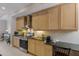 Well-equipped kitchen with stainless steel appliances, granite countertops, and wooden cabinets at 8045 Tybee Ct # 8045, University Park, FL 34201