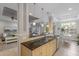 Open-concept kitchen featuring granite countertops, a breakfast bar, and seamless flow to the living area at 8045 Tybee Ct # 8045, University Park, FL 34201